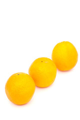 three oranges on white paper