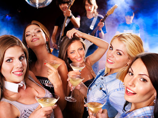 Woman on disco in night club.