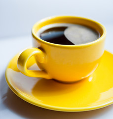 Coffee in an yellow cup