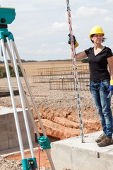 Construction worker on site at the measure