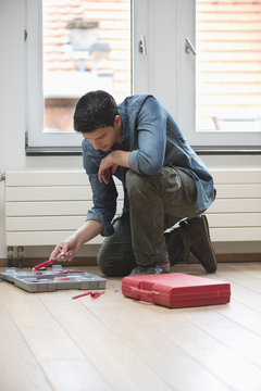 Technician arranging his toolbox