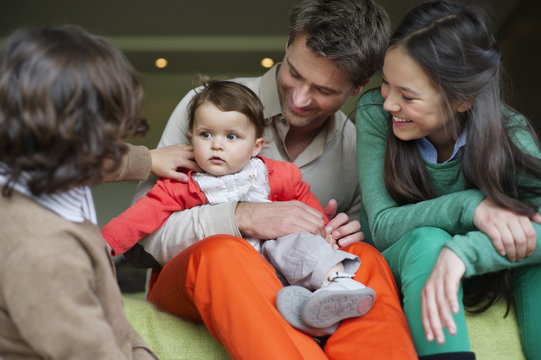 Happy man with their children at home