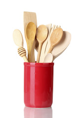 wooden kitchen utensils in cup isolated on white
