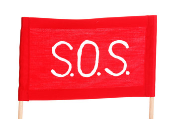 SOS signal written on red cloth isolated on white © Africa Studio