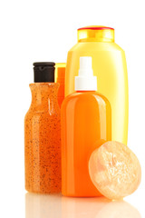 cosmetics bottles and soap isolated on white