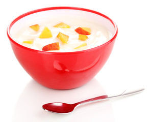 Yoghurt with peach in bowl isolated on white