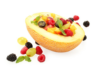 fresh fruits salad in melon  and berries, isolated on white