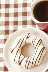 Donut and red coffee cup