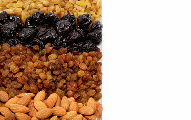 Mixed nuts and dried fruits. Almonds, raisins and prunes.