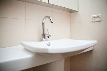 Modern bathroom sink in white ceramic