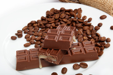 Chocolate and coffee beans on sacking.