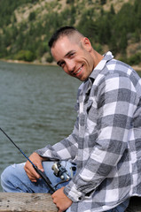 Happy man fishing