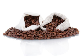 Coffee beans in canvas sacks isolated on white