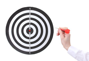 dart in hand and dartboard  isolated on white