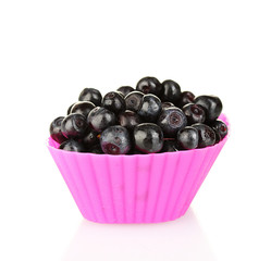 Fresh blueberries in colorful silicone mold isolated on white