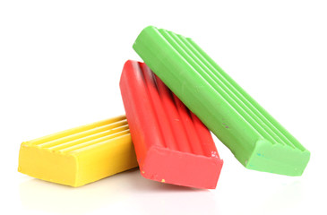 Children bright plasticine isolated on white