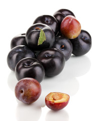 Rip plums isolated on white