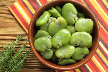 Bowl of green boiled broad beans
