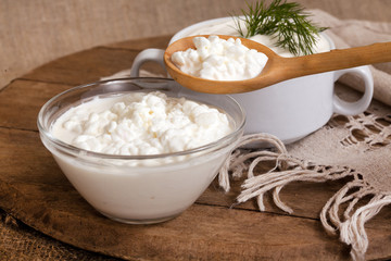 cottage cheese in a plate and a spoon with cottage cheese