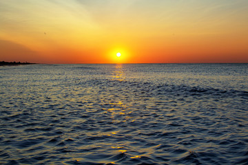 sunrise over sea with sky