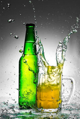 Beer bottle with water splash