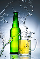 Beer bottle with water splash
