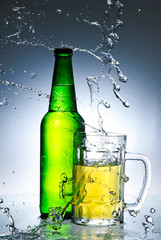Beer bottle with water splash