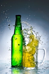 Beer bottle with water splash