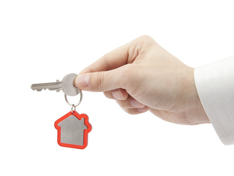 House key in hand with clipping path