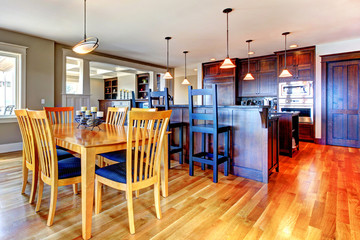 Luxury home kitchen and dining room with open floor plan.