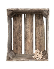 Empty rustic crate with leaf