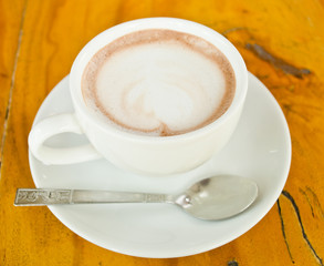 Hot coffee in cup with plate