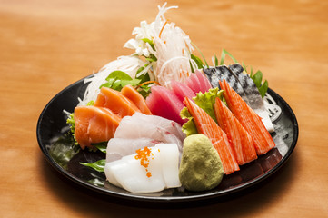 Fresh Slamon, Tuna, Saba and Squid Sashimi Sushi