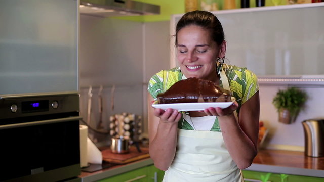 House wife presenting freshly baked chocolate cake