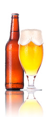Frosty glass of beer with bottle isolated