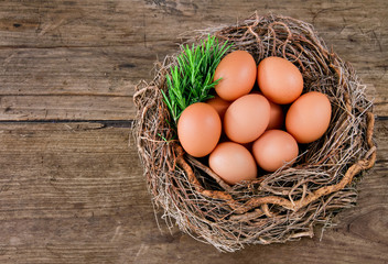 Eggs in a basket on a wooden background