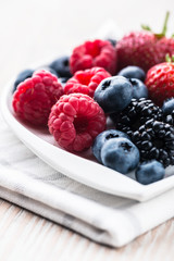 Fresh berry fruits on a plate