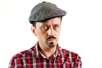 Young man serious with a cap