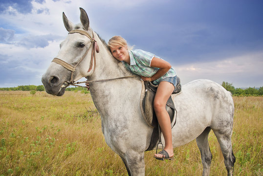 Girl and gray horse