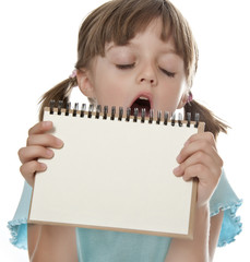 boring little girl holding empty white notebook