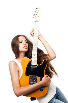 Beautiful young woman with electric guitar