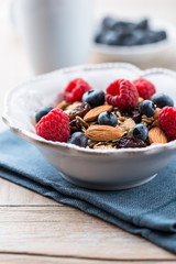 Muesli with fresh fruits, almonds and raisins