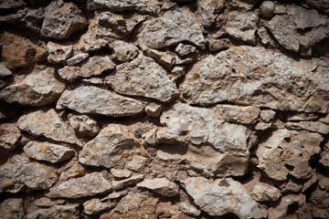 Stone wall texture background with dark edges