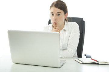 brunette young woman holding finger to mouth sign quiet