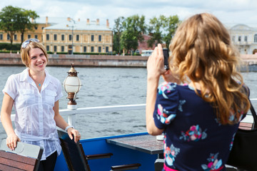 Women model posing to photographer outdoor