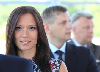 Stylish young businesswoman with her successful business team