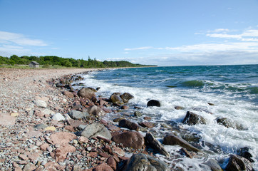 Fototapeta na wymiar Coast with rocks and a small house