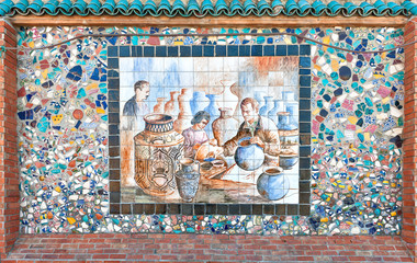 Mosaic of broken pottery and ceramics painting of artisans