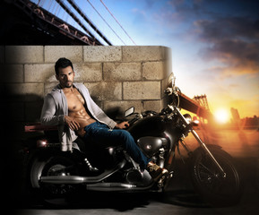 Sexy man on motorcycle - obrazy, fototapety, plakaty