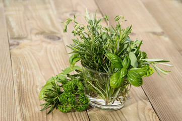 Glass with Herbs on wood